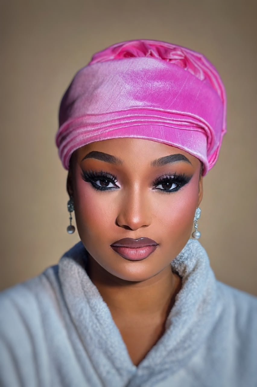 Glam makeup by glamby_meemah, model in a pink velvet headwrap with soft smoky eye and pearl earrings